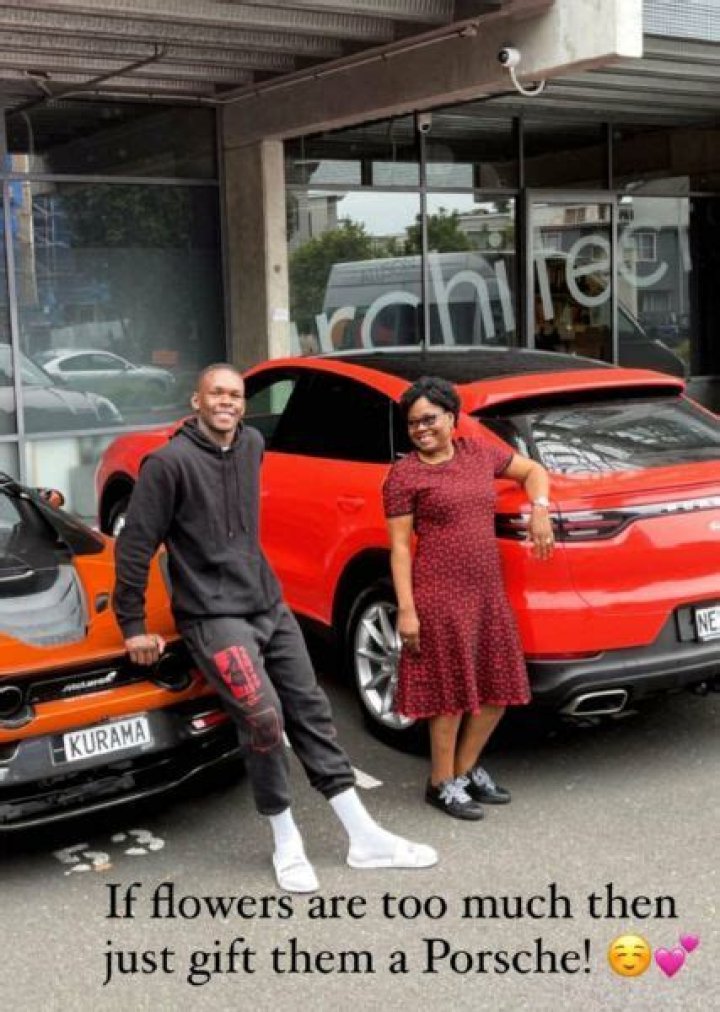 Kick Boxer, Israel Adesanya Gifts His Mum A Brand New Porsche Car